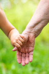 Grandchild holding randma