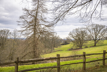 Fototapeta na wymiar Wooden fence and rolling English countryside