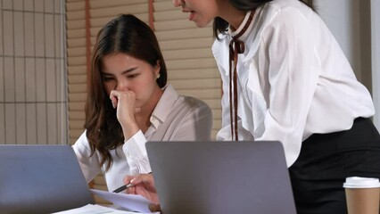 Asian colleagues shouting subordinate at office points on rude mistakes on report criticizing work, suffer from angry colleagues.
