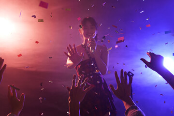 Young women singing in the bar