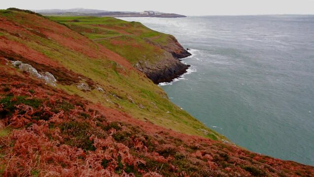 Video, Anglesey North Coastal Path, Wales. Autumn or fall path, and sea, landscape, wide angle looking west