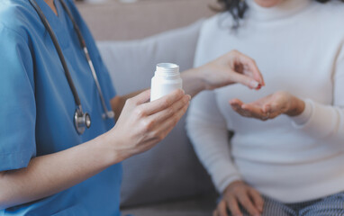 Close-up of stethoscope and paper on background of doctor and patient hands