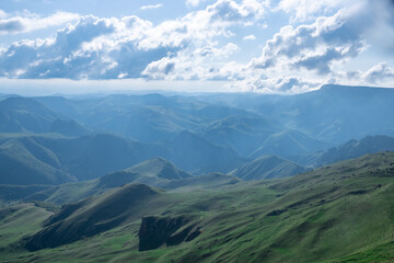 Naklejka na ściany i meble Landscape of the Caucasus Mountains on a summer day