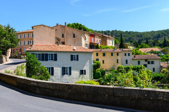 Travel destination, small ancient village Cotignac in Var, Provence, surrounded by vineyards and cliffs with troglodytes houses.