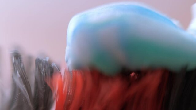 super macro squeeze toothpaste onto toothbrush, Health care, dental hygiene.