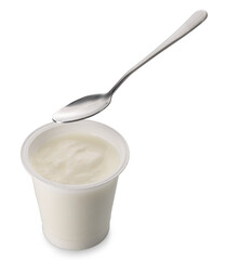 White yoghurt in plastic jar with teaspoon isolated