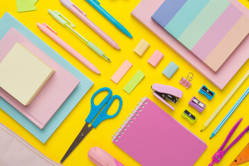 Flat lay with colorful school stationery on color backgroung, top view