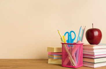 Composition with books and stationery on wooden table. Back to school concept