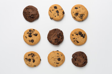 Flat lay with chocolate chip cookies on white background