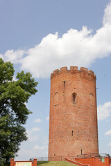 Belaya Vezha tower. From red brick. Against the background of the sky.