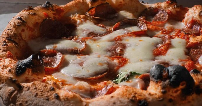 Closeup shot of neapolitan pizza prepared accordiing to the traditional italian recipe. Pizza prepared in the stone stove