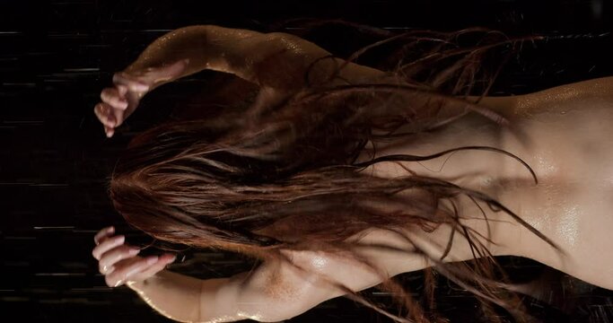 Back View of Naked Sexy Hot Slim Woman Washing Hair While Taking a Shower At Home Slow motion Vertiacl View Slow motion woman gets pleasure from water procedures Daily routine Liestyle, relaxation