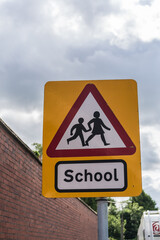 View of school ahead warning road sign, travel and information concept illustration.