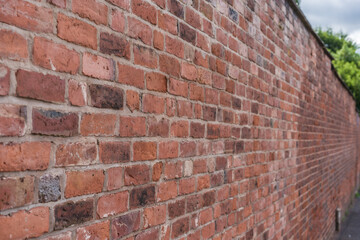 View of weathered brick wall, material, texture and construction concept illustration.