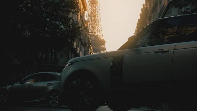 Silhouettes of moving cas and the Eiffel Tower in the centre of Paris, France