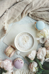 Cup of coffee, sweet macaroons and white peonies, beautiful aesthetic photo