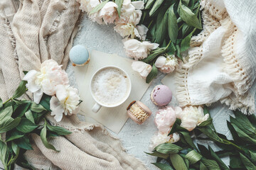 Cup of coffee, sweet macaroons and white peonies, beautiful aesthetic photo