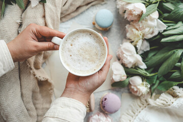 Cup of coffee in hand, good morning concept