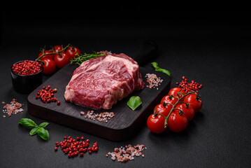 Fresh, raw beef steak with salt, spices and herbs