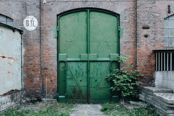 large steel doors to an old industrial hall 