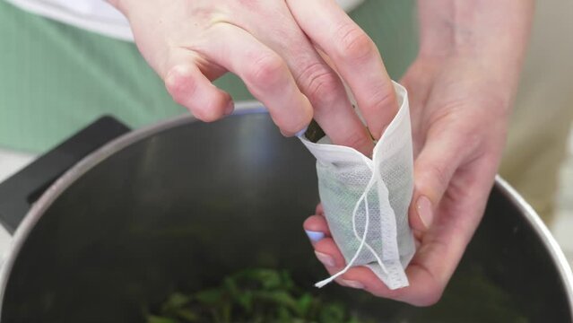 The process of packing the collection of tea herbs in convenient portioned bags.