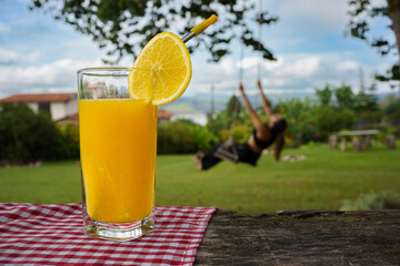 Orange juice in landscape