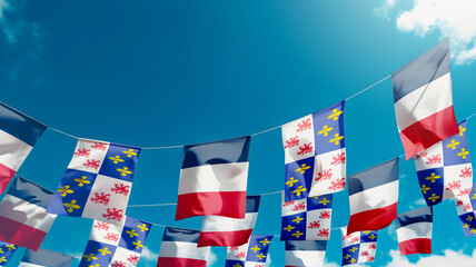 Flag of Picardy - France against the sky, flags hanging vertically
