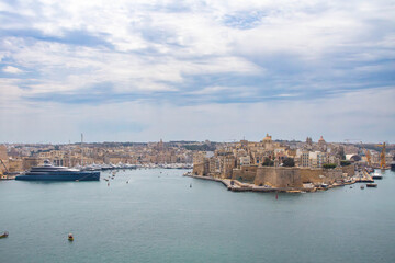 View at the Grand Harbour and the Malta Three Cities (Birgu, Senglea, and Cospicua) from Valletta, Malta. Mediterranean sea.