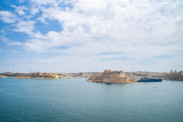 Fototapeta na wymiar View at the Grand Harbour and the Malta Three Cities (Birgu, Senglea, and Cospicua) from Valletta, Malta. Mediterranean sea.