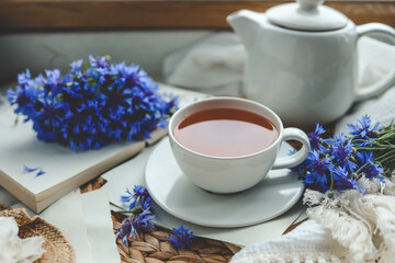 Cup of hot tea and spring home interior. good morning concept