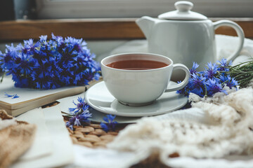 Cup of hot tea and spring home interior. good morning concept