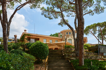 Spanish real estate of Mediterranean seashore. Yard of the beautiful luxury classical spanish villa