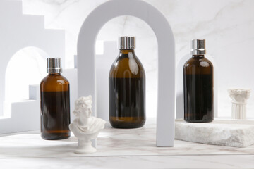 Creative studo shot of brown glass cosmetic bottle on marble background