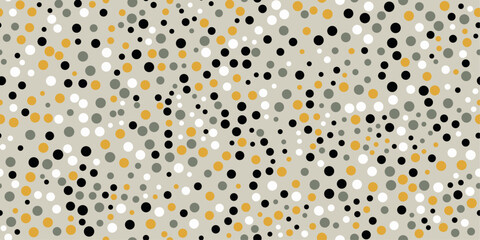 Dots on a gray background. Vector pattern of dots scattered over the surface. For prints and seamless coverings such as wallpapers, cushions, packaging. Black, yellow and gray dots.