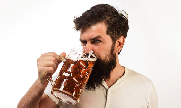 Celebration oktoberfest festival. Bearded man drinking mug of craft beer. Stylish man drinking draft delicious beer. Guy enjoying cold pint of beer in bar. Bearded male tasting fresh brewed beer.