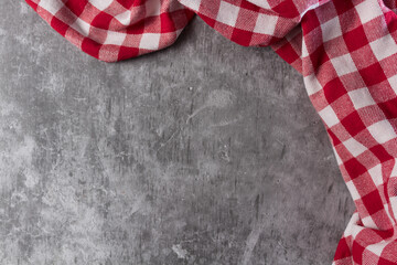 Fototapeta premium red and white tablecloth on a concrete table