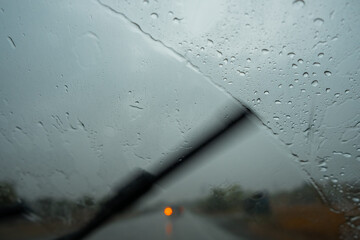 car windshield wipers clean glass from rain close up