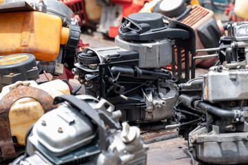 The engine of the old lawn mower is a household item, the small engine while being modified to repair the internal parts to be able to use normally - obrazy, fototapety, plakaty