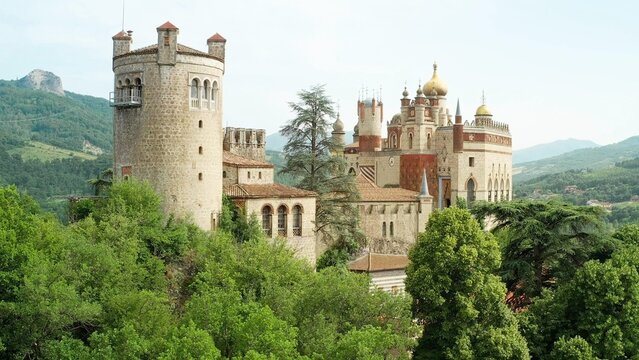 Aerial drone panoramic view of the Rocchetta Mattei castle in Italy on sunny summer day, view from above. 