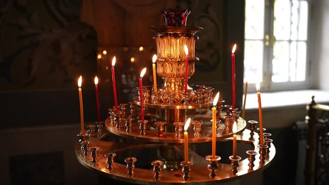 Candilo with candles in an Orthodox church