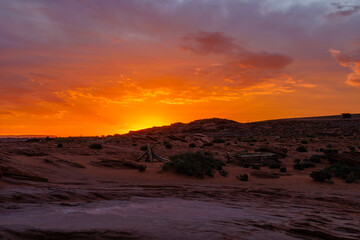 Orange sunrise with clouds in the desert near Page, Arizona during spring
