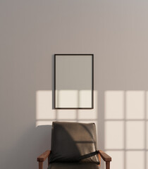 simple portrait frame mockup poster above the chair hanging on the white wall light by sunlight