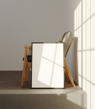 simple photo frame laying on the side of the chair in the clean interior light by sunlight from window