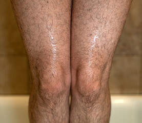 wet hairy woman's legs 