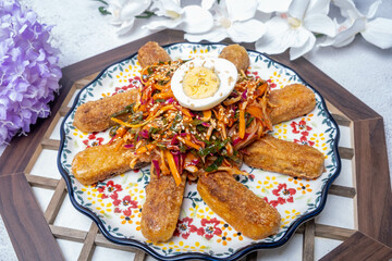 Delicious Korean Food Deep-fried Mandu and Vegetables in Spicy Sauce