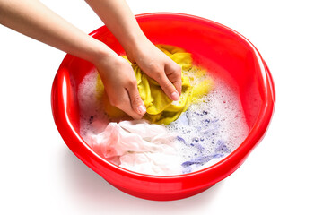 Woman washing clothes in plastic basin isolated on white background