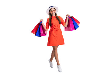 positive teen girl shopaholic in studio. teen girl shopaholic on background. teen girl shopaholic with bags. teen girl shopaholic isolated on white