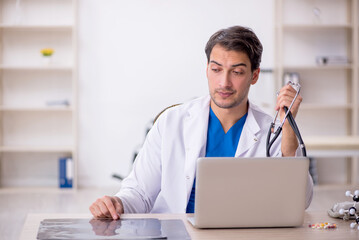 Young male doctor radiologist working in the clinic