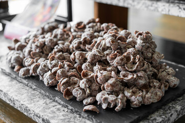 pile cocoa white chocolate corn flakes on black marble tray for sweet delicious dessert or fat snack or crispy bakery food in cafe restaurant and chocolate bars