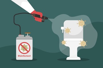 man disinfects a home toilet with a disinfectant spray